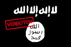 Ein Banner der Organisation IS mit arabischen Schriftzeichen.
